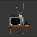 Vintage TV With Antenna On Wooden Table Remote Control Potted Plant And Books