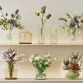 Decorative Glass Vases With Purple And White Flowers And Greenery On Shelves