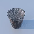 Two Metal Mesh Trash Cans With Crumpled Paper One Tipped Over On Light Blue Surface