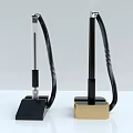 Modern Desk Pen With Black Gold Base Metal Body Coiled Cable On White Surface