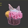 Colorful Unicorn Themed Cupcake With Multicolored Frosting And Decorative Toppings