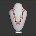 Red Beaded Necklace With Floral Cross Design On White Mannequin