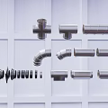 Different Types of Plumbing Pipe Fittings Including T Joints Elbows and Straight Pipes