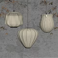 Elegant Beige Paper Lanterns Hanging As Pendant Lights With Pleated Design And Bamboo Leaves