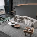 Modern Living Room Interior With Striped Curved Sofa And Round Coffee Table Set