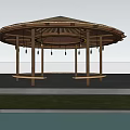 Round Pavilion With Thatched Roof Wooden Pillars And Waterfront Grass Area