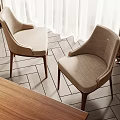 Comfortable Beige Upholstered Accent Chairs With Wooden Legs In Cozy Indoor Space