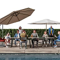 People enjoying outdoor gathering by table with umbrellas near pool and hedge