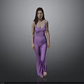 Full Length Woman In Purple Jumpsuit Standing Barefoot Against Gray Background