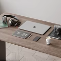 Silver Apple MacBook Laptop on Wooden Desk with Headphones Notebook Pencils Mouse Pad and Camera