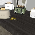 Colorful Toasters As Kitchen Appliances On Counter With Toasted Bread