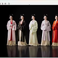 Women in Traditional Attire Standing in Line on Reflective Floor with Black Background