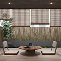 Wooden Tea Table And Chairs In Outdoor Patio With Bamboo Fence Blinds And Green Plants