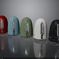Assorted Colored Electric Kettles with Silver Handles on Reflective Surface
