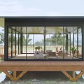 Modern Waterfront Cabin With Glass Walls And Wooden Deck Surrounded By Trees