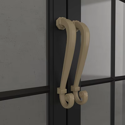 Beige Curved Decorative Door Handles Mounted On Dark Door With Gray Wall Background 3d model
