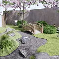 Rockery Stones In Traditional Japanese Garden With Lush Grass Stone Paths And Cherry Blossoms