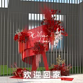 Vibrant Red Floral Installation With Welcome Home Sign And Modern Metal Fence
