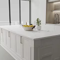 Modern Open Kitchen Interior With White Cabinets Marble Countertop Fresh Fruits And Green Plant