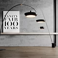 Modern Black Arched Floor Lamp In Room With Gray Wall And Wooden Floor