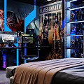 Gaming Desk Setup With Dual Monitors Displaying Gameplay Keyboard Mouse And Figurines