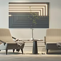 Beige Leisure Chairs With Small Round Table Green Plant And Illuminated Abstract Wall Art
