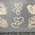 Golden Hand painted Wall Decor with LOVE JOY Heart and Floral Patterns on White Brick Wall
