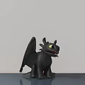 Black Dragon Doll with Wings and Yellow Eyes Standing on Gray Surface