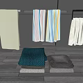 Colorful Striped and Plain Towels Hanging on Racks and Folded on Wooden Floor