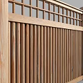 Wooden Building Exterior Wall With Traditional Lattice Design And Vertical Slats