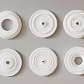 White Decorative Ceiling Medallions Displaying Various Circular Patterns And Intricate Designs