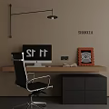 Modern Desk With Computer Monitor Open Book Decorative Painting And Black Chair