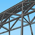 Steel Truss Bridge Structure With Metal Frame Under Clear Blue Sky