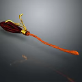 Red Decorative Object With Golden Accents And Long Handle On Gray Background