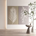 Decorative Wall Art With Palm Leaf And Feather Prints On Light Colored Wall 3d model