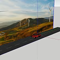 Red Vintage Car Driving On Road With Mountains Green Fields Wind Turbines And Sunset Sky