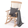 Cozy Wooden Rocking Chair with Gray Cushion and Soft Comfortable Blanket
