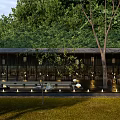 Tranquil Courtyard Garden With Lush Trees Open Seating And Warm Lighting
