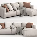 Modern Beige Sectional Sofa With Brown And Gray Pillows And Throw Blanket 3d model