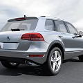 Silver Volkswagen SUV With Front Grille Design And Alloy Wheels On Open Road