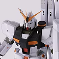 White Gundam Model With Orange Accents Black Parts Long Back Armor Pieces Holding Gun