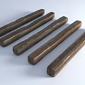 Six Dark Colored Stone Wood Long Strips With Textured Surface Neatly Arranged On Light Background