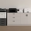 Office Appliances Including Multifunctional Printers On Storage Cabinet With White Wall And Wooden Floor