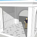 White Architectural Structure With Arched Doorway And Standing Person