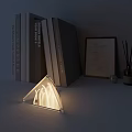 Modern Tower Shaped Lamp On Tabletop With Stacked Books Picture Frame And Reed Diffuser 3d model