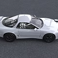 White Mitsubishi Sports Car With Pop Up Headlights On Road