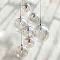 Transparent Glass Globe Pendant Lights With Multiple Hanging Design And Warm LED Bulbs