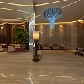 Modern Luxury Sales Office Interior Design With Chandelier Sofa Seats Green Plants And Marble Floor