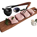Raw Pork Tenderloin on Wooden Cutting Board with Rosemary Garlic Mortar and Fork