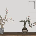 Decorative Vases With Pink Flowering Branches Gray And Black White Striped On Wooden Surface Against Light Wall With Niches